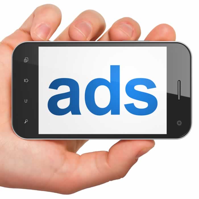 Google Ads - Hand holding a mobile phone