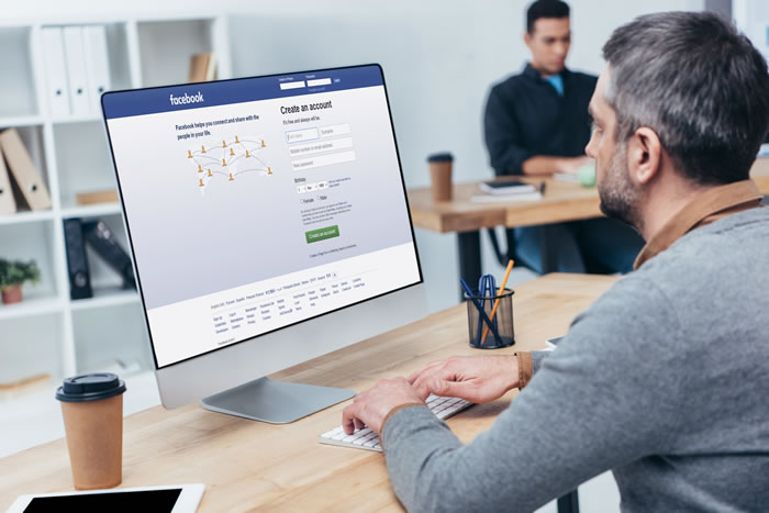 Social Media for Business - A Businessman Using FaceBook