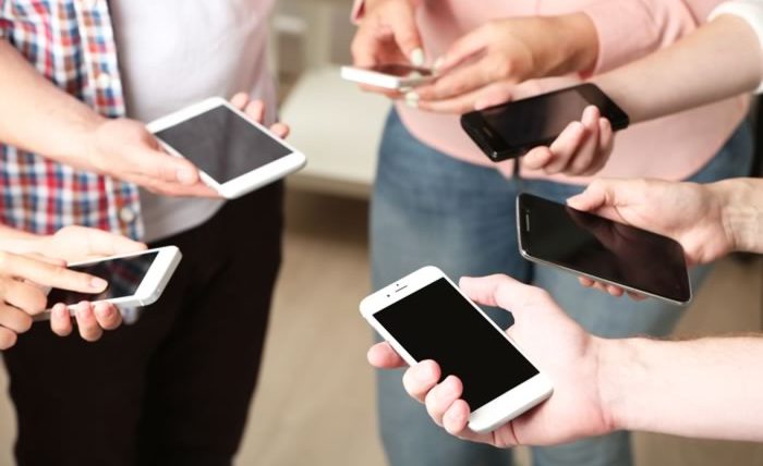Social Media - Engaging Your Audience Where They Are - People Using their Mobile Phones